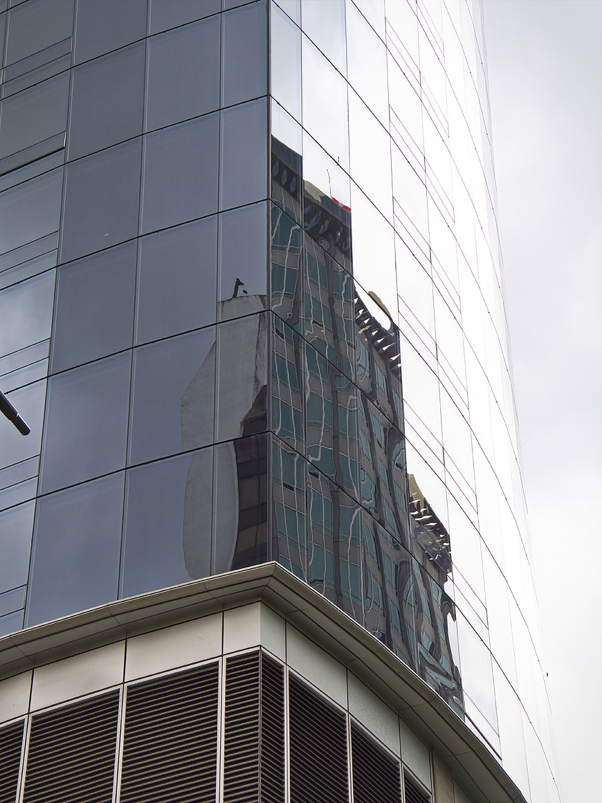 Modern Glass Building Facade with Reflections