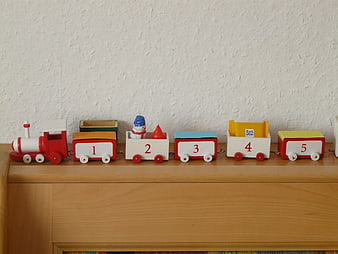 Colorful Wooden Toy Train with Numbers on Shelf