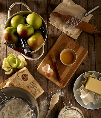Flat lay of baking ingredients and tools on rustic wooden table