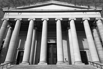 Black and white low angle view of classical courthouse columns