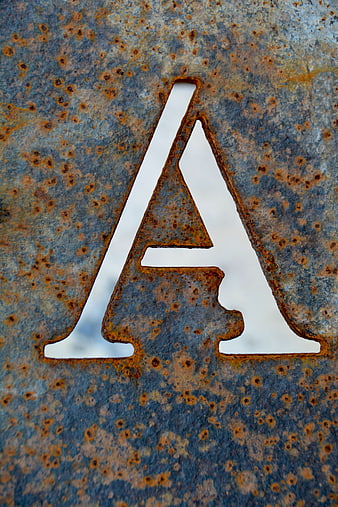 Rusty Metal Letter A Cutout on Weathered Steel Plate