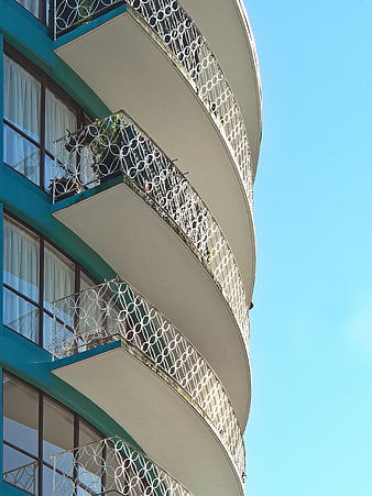 Curved Art Deco Balconies Against Blue Sky