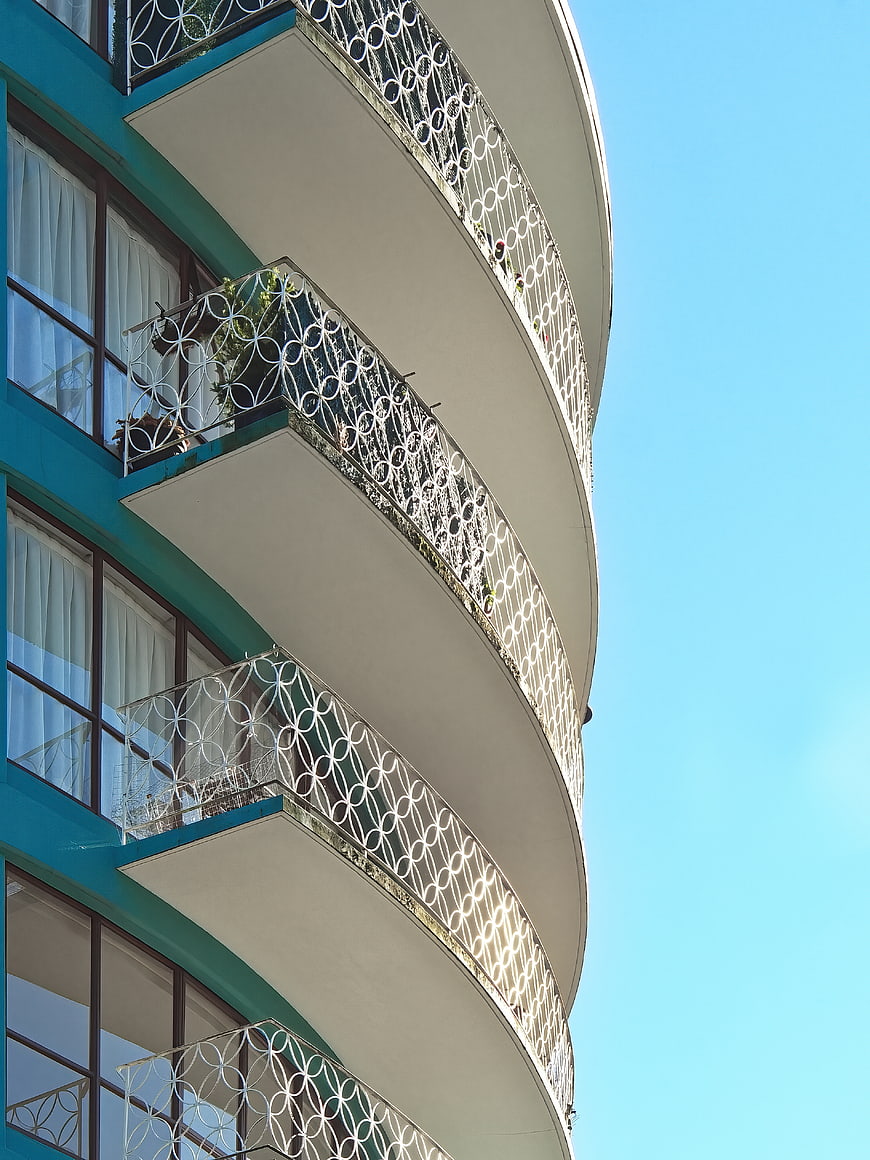 Curved Art Deco Balconies Against Blue Sky