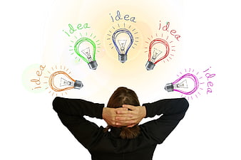 Woman with hands on head and colorful lightbulb idea doodles