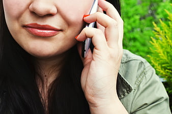 Close-up of woman talking on smartphone outdoors