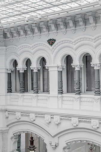 Ornate white architectural arches and columns in a historic building