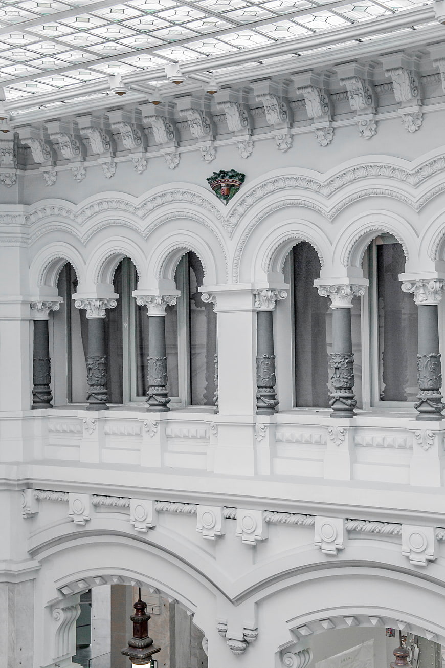 Ornate white architectural arches and columns in a historic building
