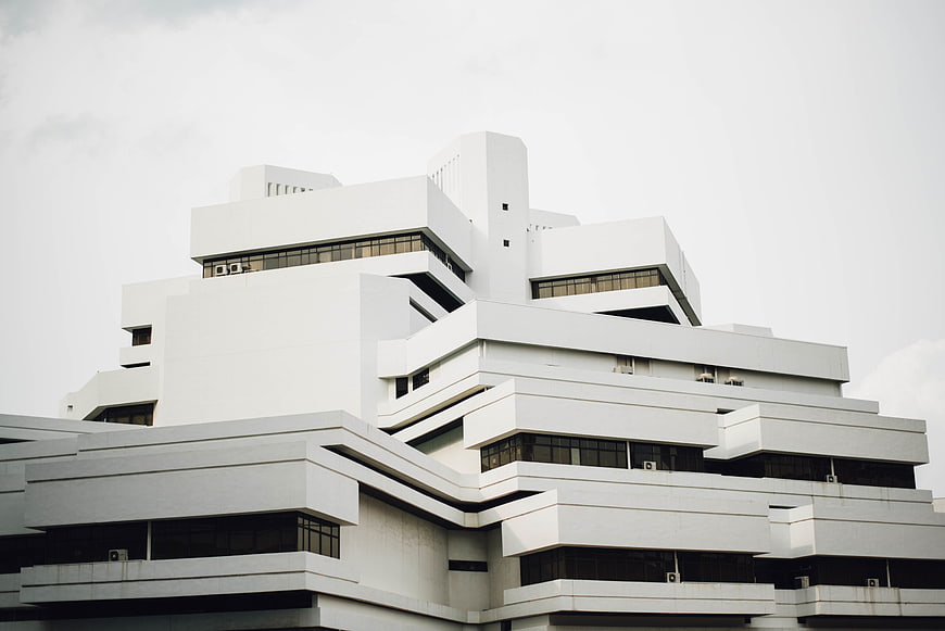 Modern White Geometric Architecture Against Overcast Sky