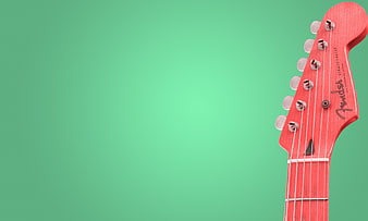 Red Fender Stratocaster Guitar Headstock on Green Background