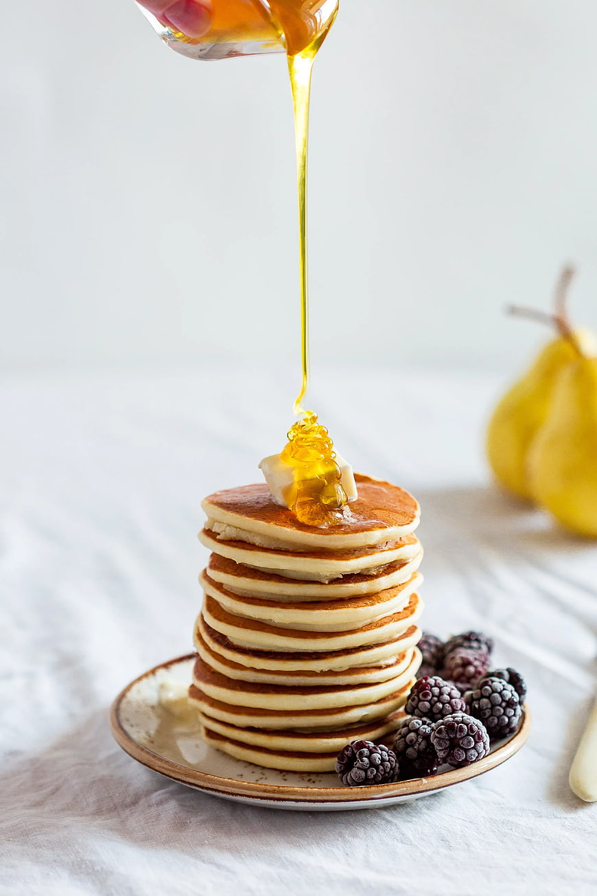 Stack of Pancakes with Honey and Blackberries