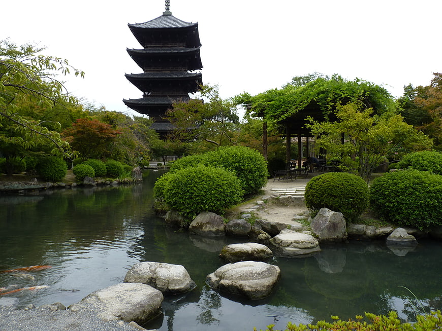 Traditional Japanese Garden With Pagoda, Pond, And Koi Fish