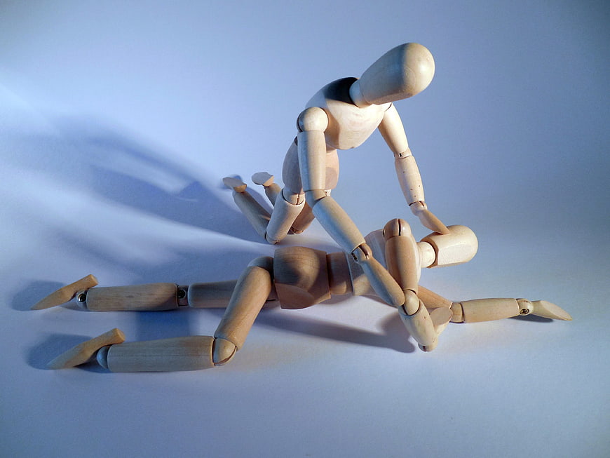Wooden Mannequins Depicting First Aid Rescue Scene
