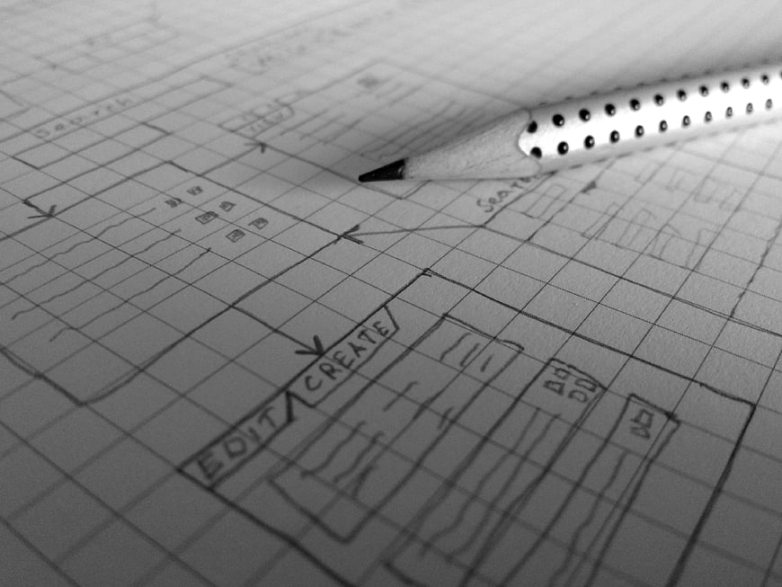 Pencil on wireframe sketch for web design planning