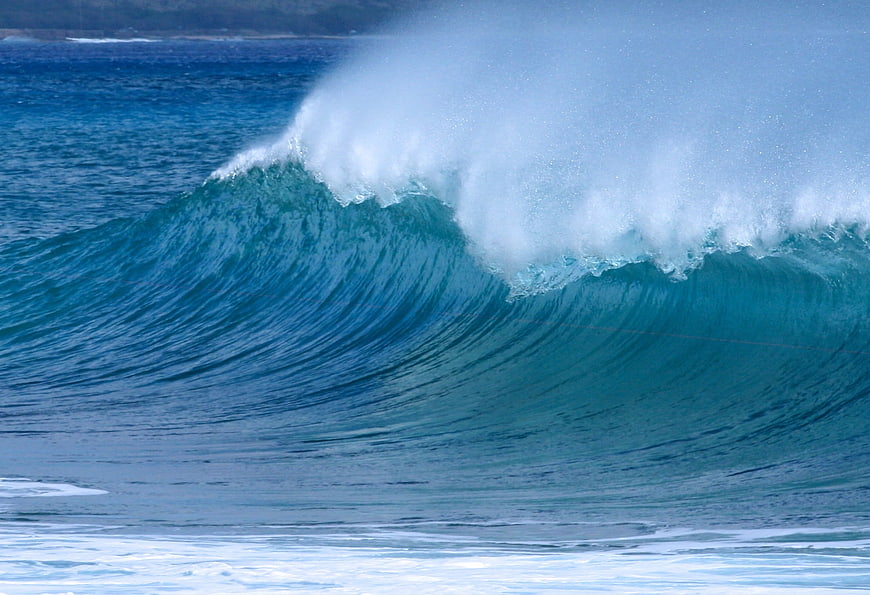 Powerful Blue Ocean Wave Breaking With White Sea Spray