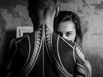 Black and white portrait of couple with tribal body paint