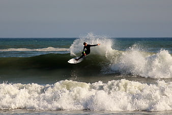 Surfer riding a wave in the ocean