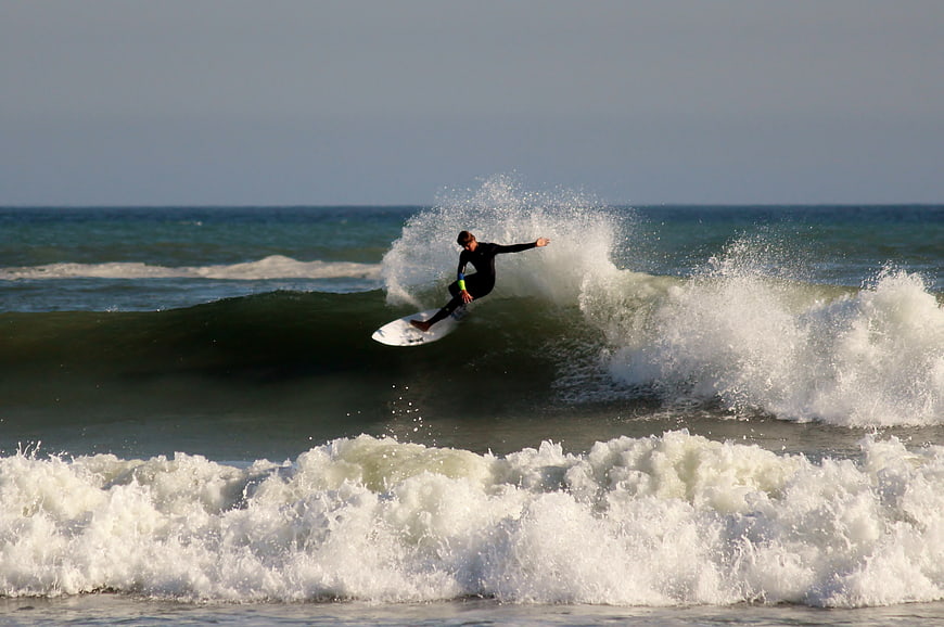 Surfer riding a wave in the ocean