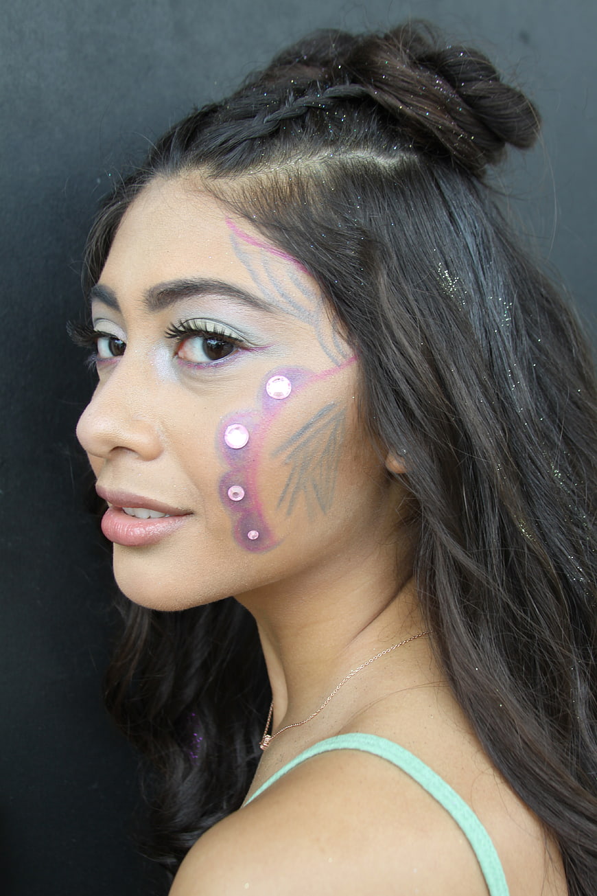 Woman with Fantasy Face Paint and Glitter Hair Portrait