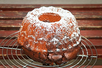 Rustic Bundt Cake Dusted With Powdered Sugar On Wire Rack