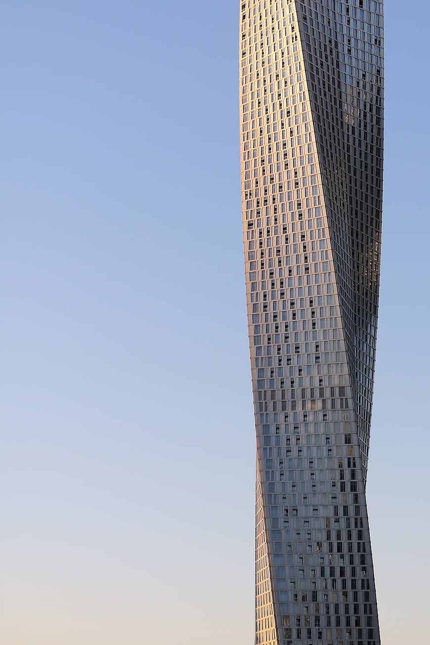 Twisted Skyscraper Architecture Against Blue Sky