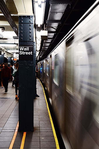 Motion blur subway train arriving at Wall Street station