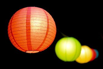 Glowing Red Paper Lantern Against Black Background