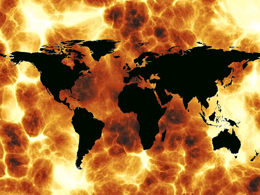 Global map silhouette on fiery solar surface background