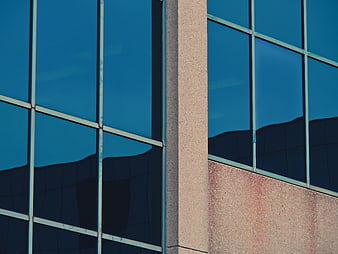 Modern office building facade with blue glass windows