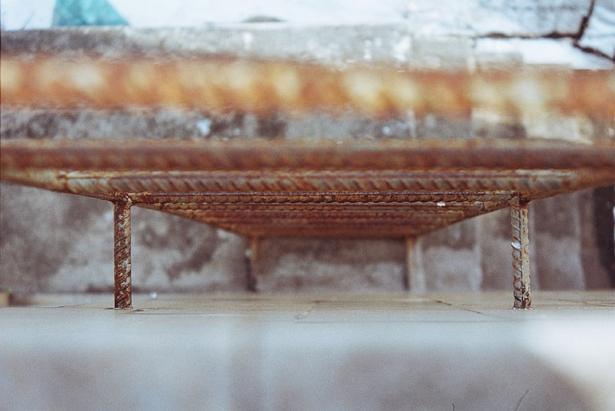 Close-up of rusty metal rebar construction frame