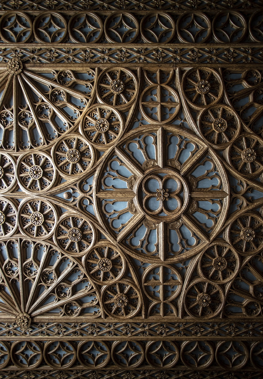 Intricate Carved Wooden Ceiling Detail With Geometric Floral Patterns