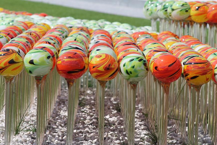 Colorful glass art installation with vibrant swirling patterns