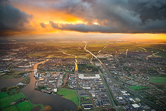 Aerial View of City and River at Golden Hour Sunset