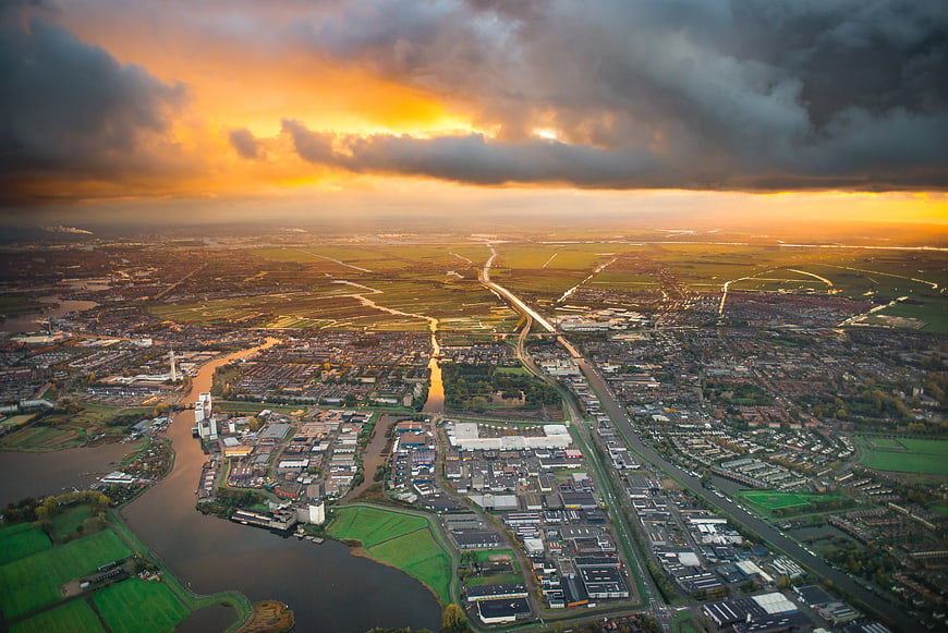 Aerial View of City and River at Golden Hour Sunset