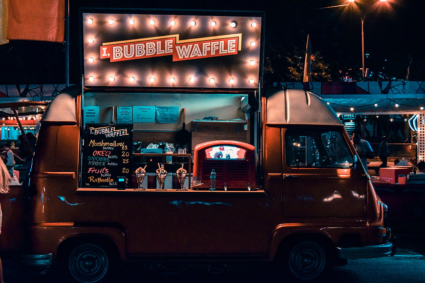 Vintage Food Truck Selling Bubble Waffles at Night Market