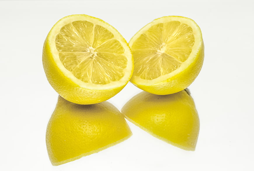 Fresh Cut Lemon Halves on White Background