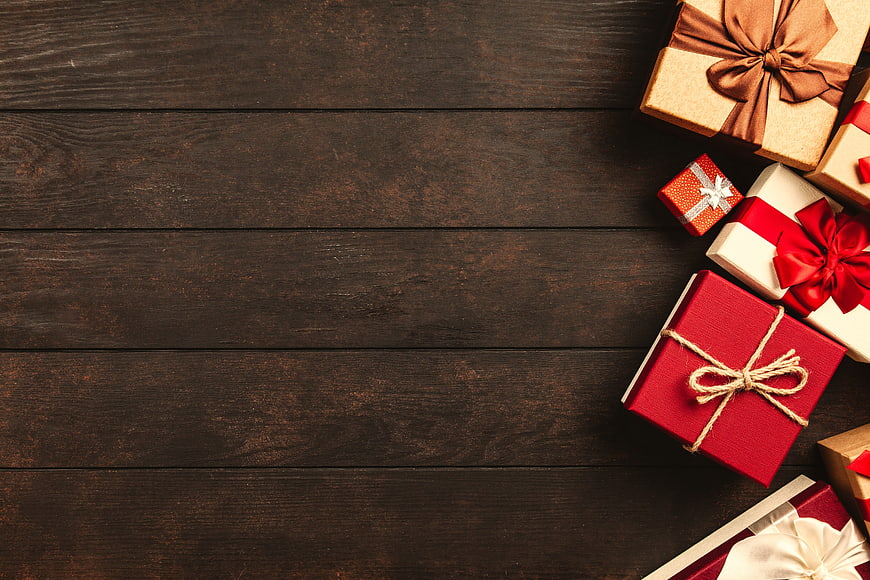 Christmas Gift Boxes On Dark Wooden Table With Copy Space