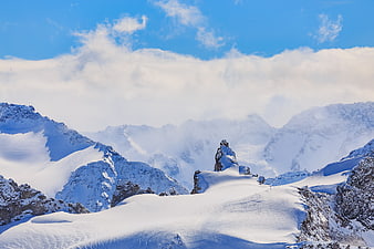 Snowy Mountain Peaks with Clouds in Swiss Alps