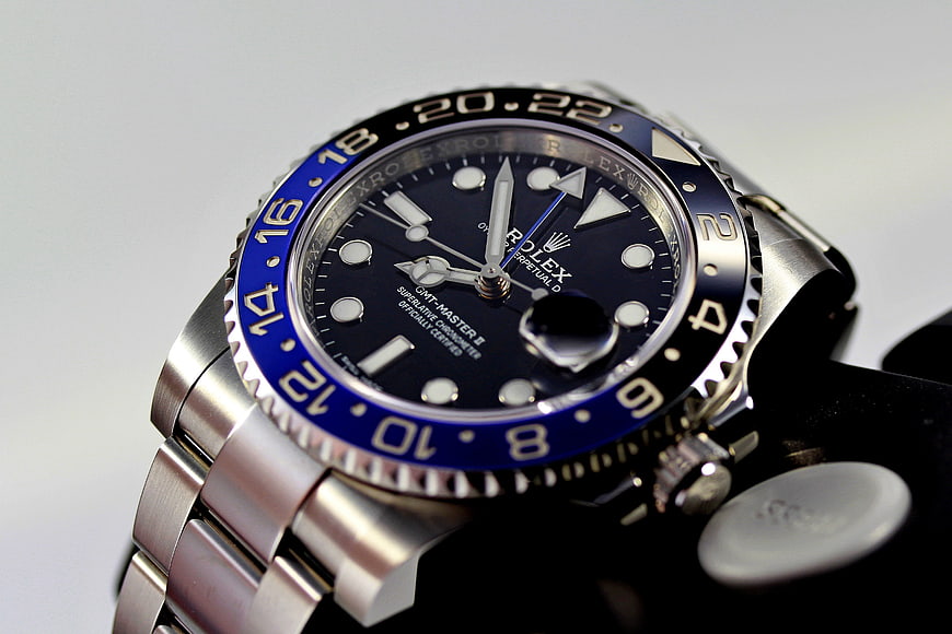 Close-up of a luxury Rolex GMT-Master II wristwatch with blue and black bezel