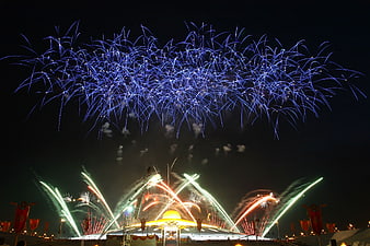Spectacular Blue Fireworks Display Over Night Festival