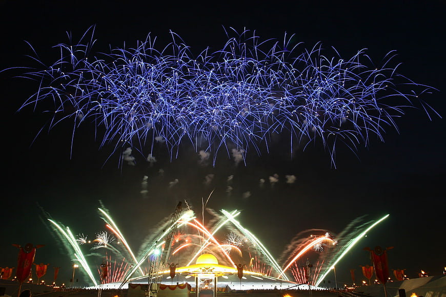 Spectacular Blue Fireworks Display Over Night Festival