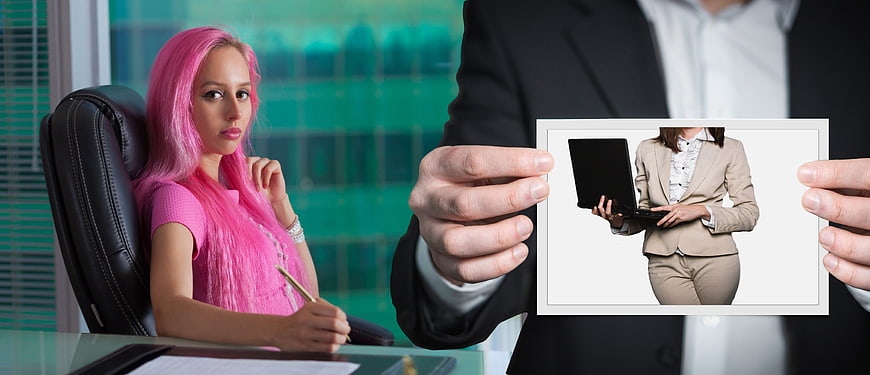 Businessman showing photo of woman to pink-haired colleague