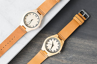 Minimalist Wooden Watches with Leather Straps on Marble and Wood