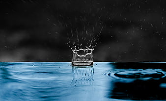 High-speed water splash crown on dark background