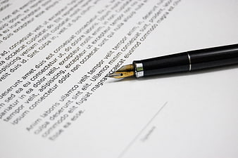Close-up of fountain pen on legal document text