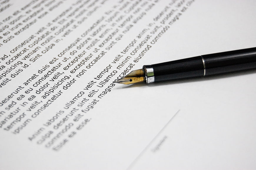 Close-up of fountain pen on legal document text
