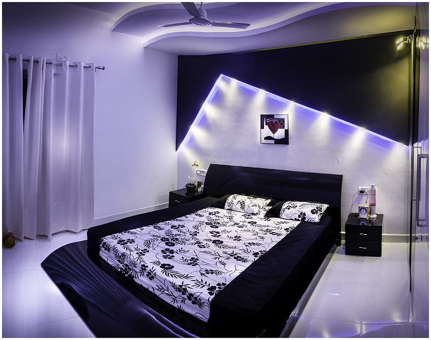 Modern Bedroom Interior With Black Bed And LED Accent Lighting