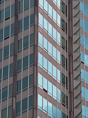 Modern Glass Office Building Facade with Geometric Window Pattern