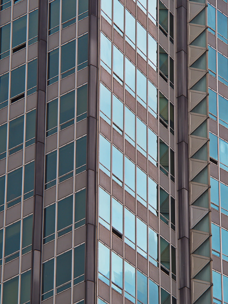 Modern Glass Office Building Facade with Geometric Window Pattern
