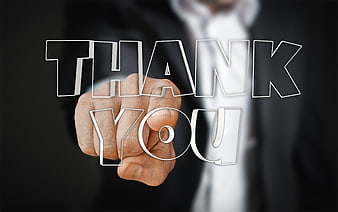 Businessman Hand Writing Thank You on Glass Screen
