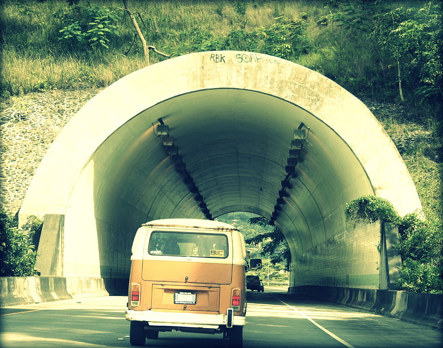Vintage Camper Van Driving Through Concrete Tunnel